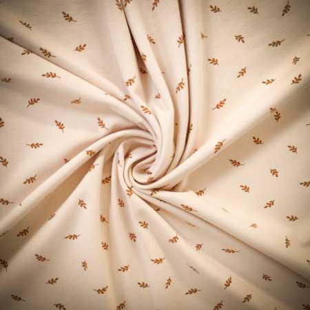 Tissu jersey coton biologique imprimé  "Feuilles dorées" - Beige Clair